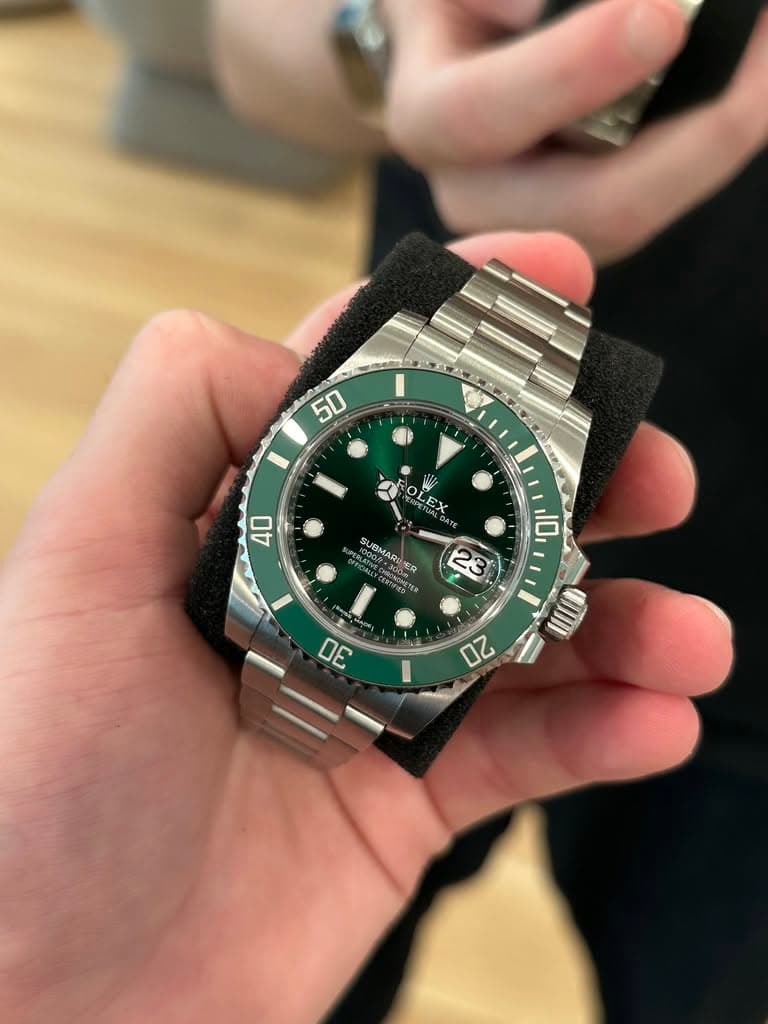May be an image of wrist watch and text