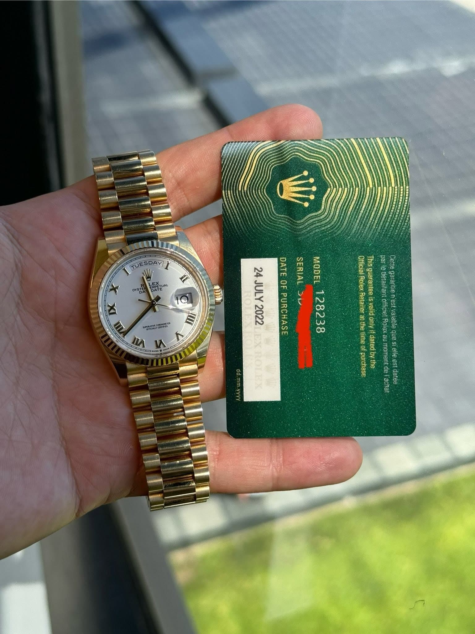 May be an image of wrist watch and text