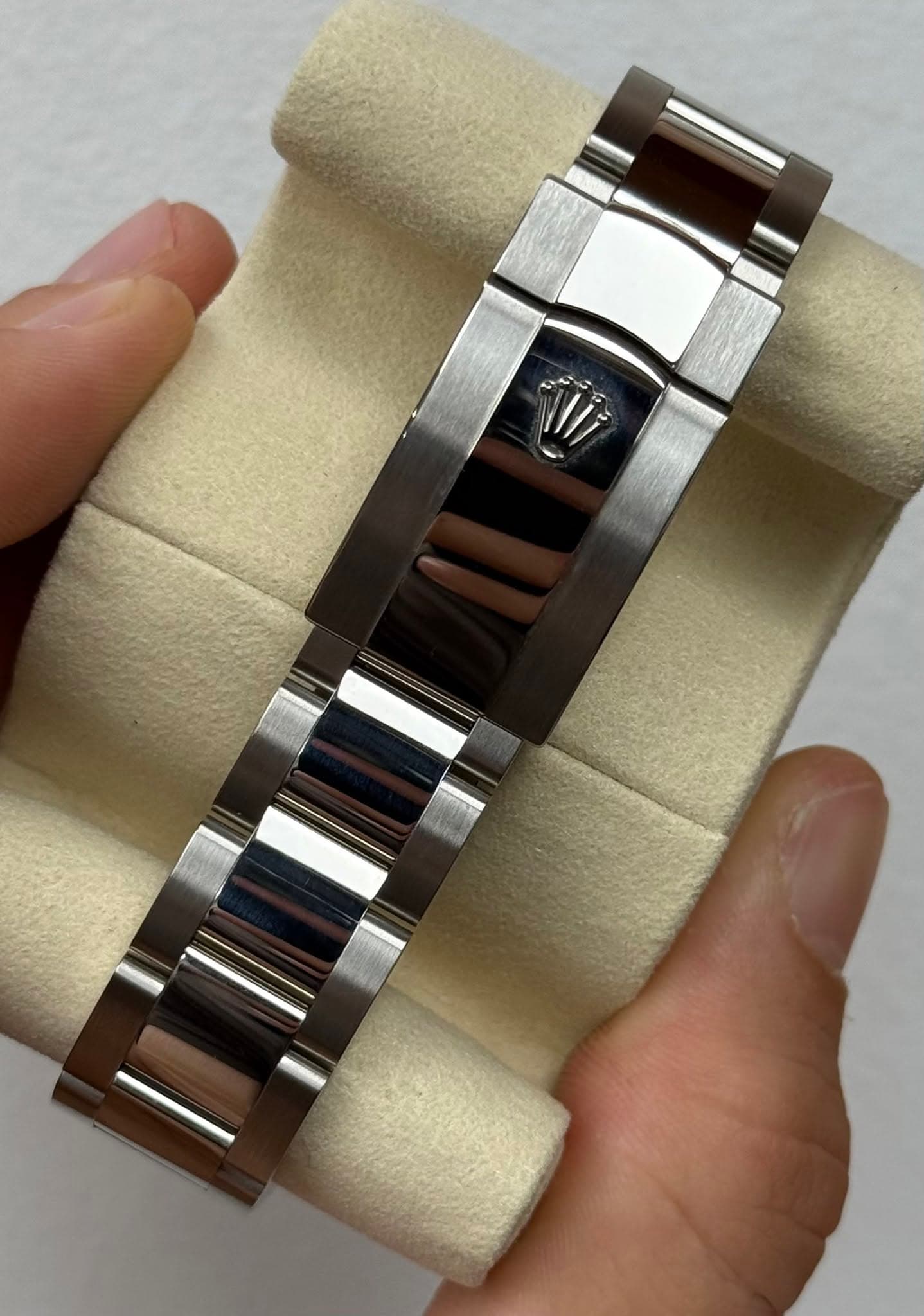 May be an image of jewelry, wrist watch and text