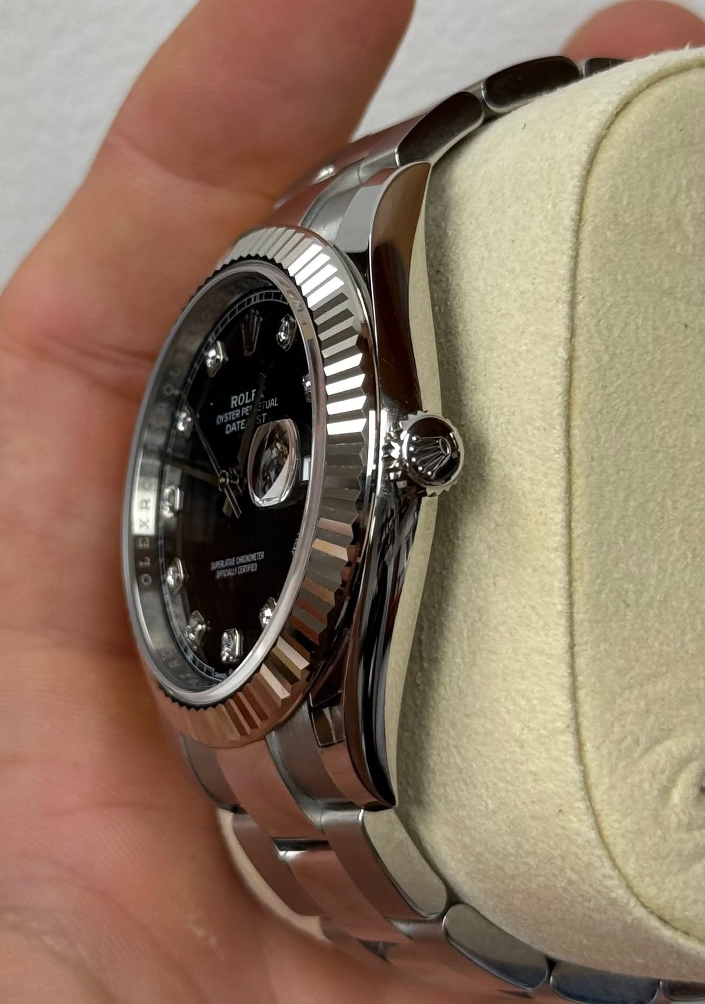 May be an image of wrist watch and text