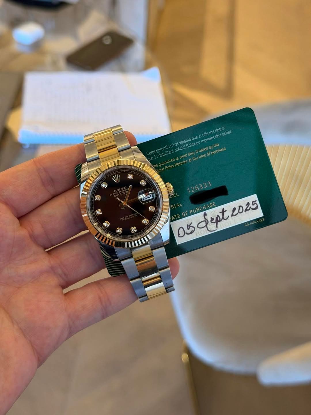 May be an image of wrist watch and text