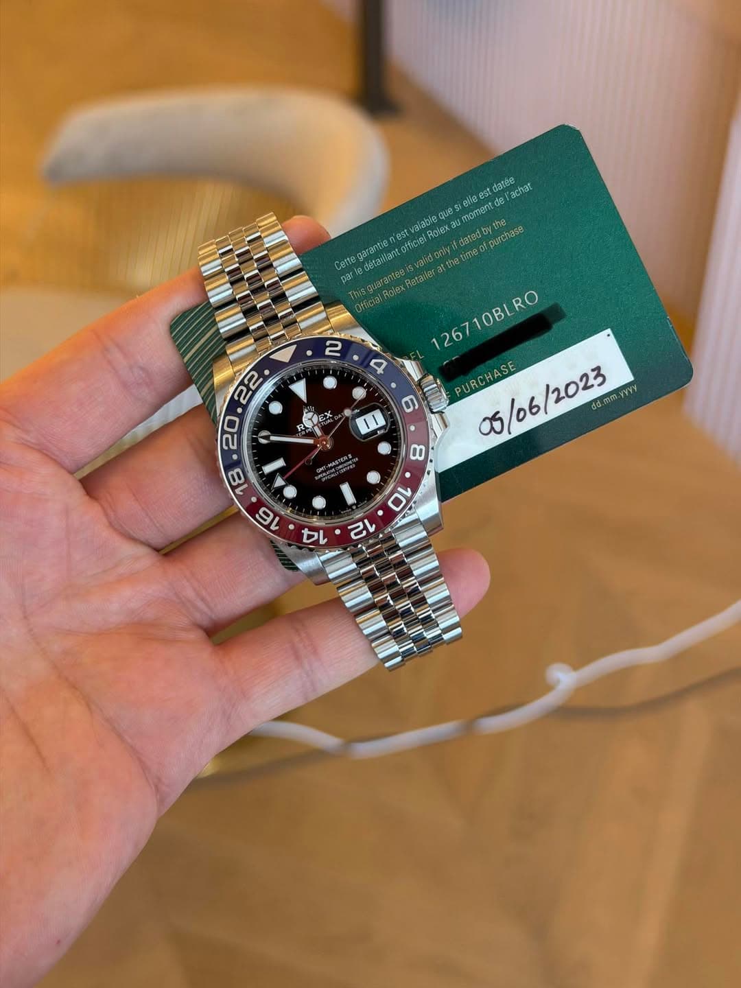May be an image of wrist watch and text