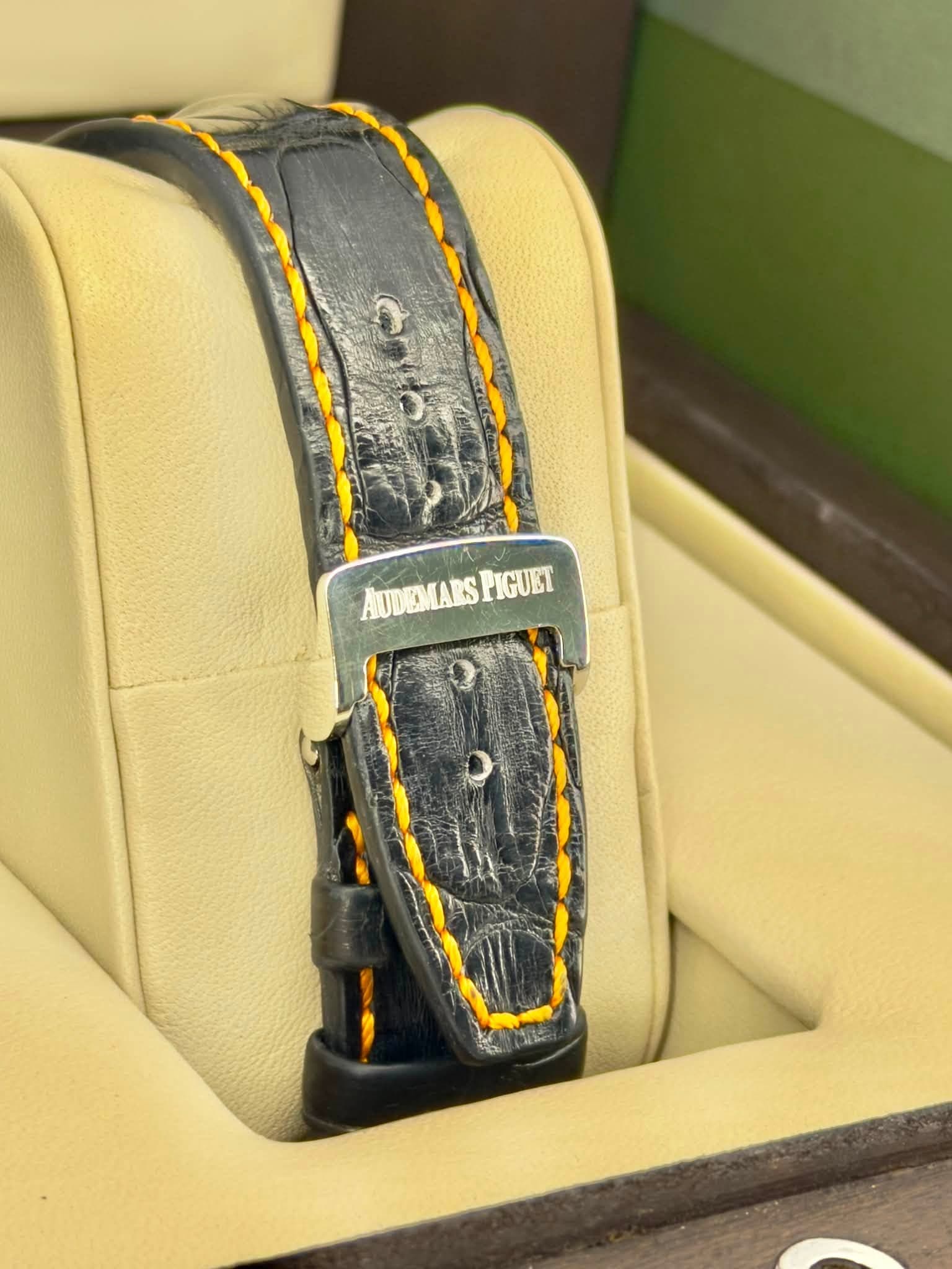 May be an image of leather, saddle-stitched leather, wrist watch and text that says 'AUDEMARSPIGUET AUDEMARS PIGUET'