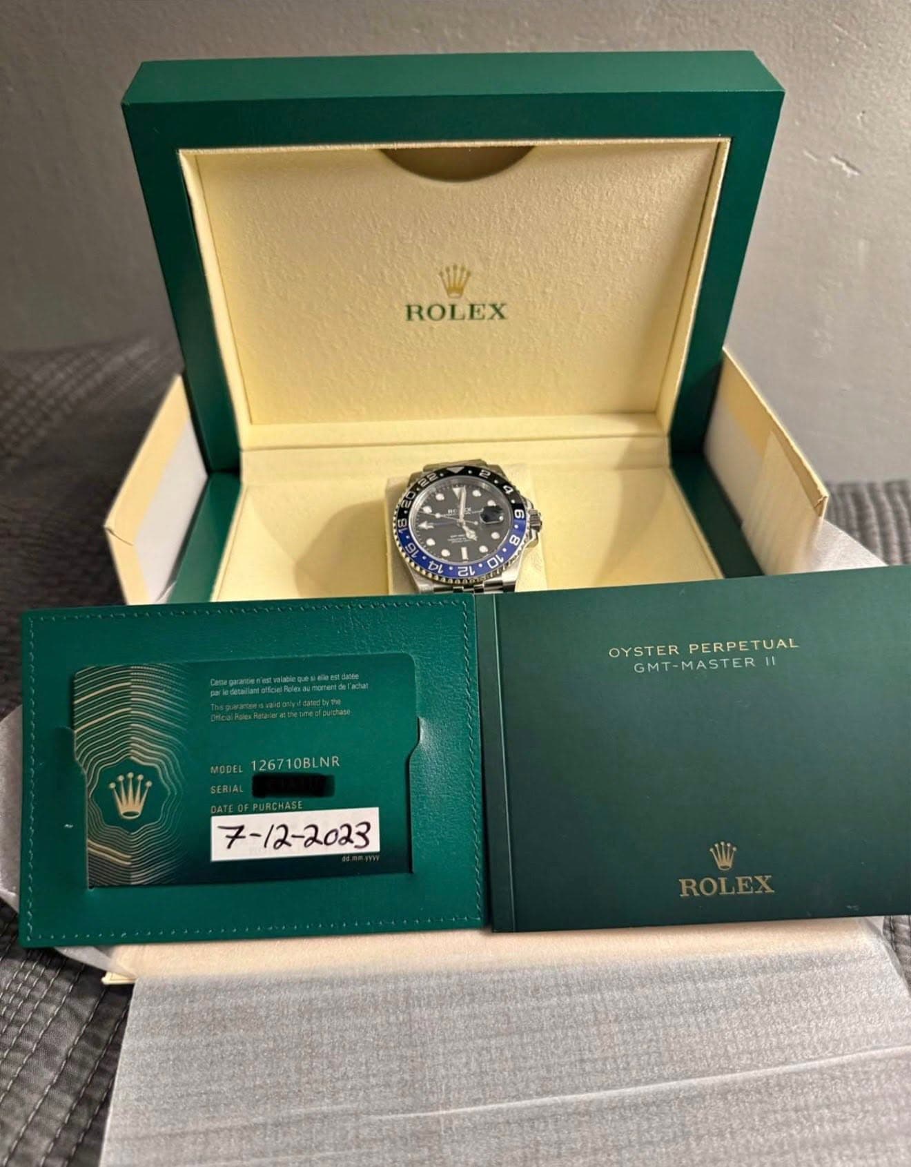 May be an image of wrist watch and text that says 'W ROLEX C ကာ 0% ဆန် o PL 2L 23 OYSTER PERPE PERPETUAL OYSTERPERPETUAL TUAL GMT-MASTER 126710BLNR - ROLEX ROL'