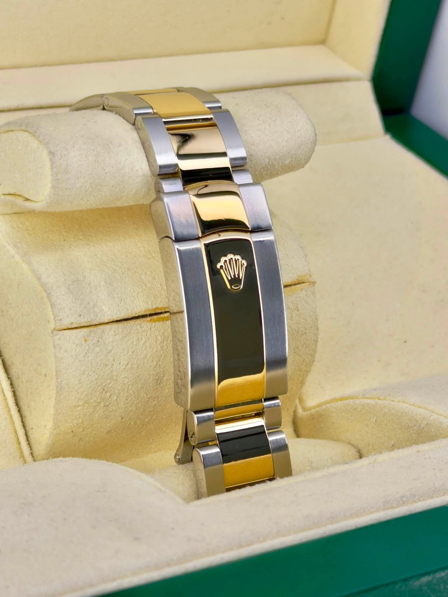 May be an image of jewelry, wrist watch and text