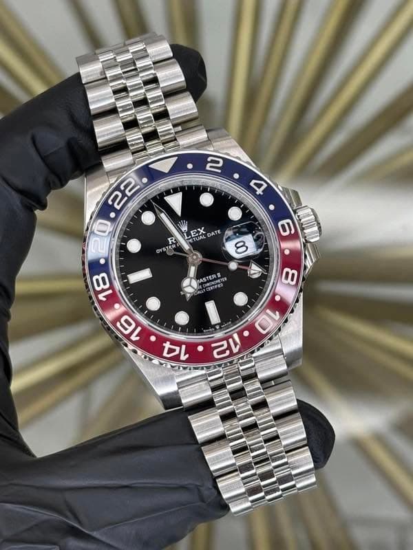 May be an image of wrist watch and text