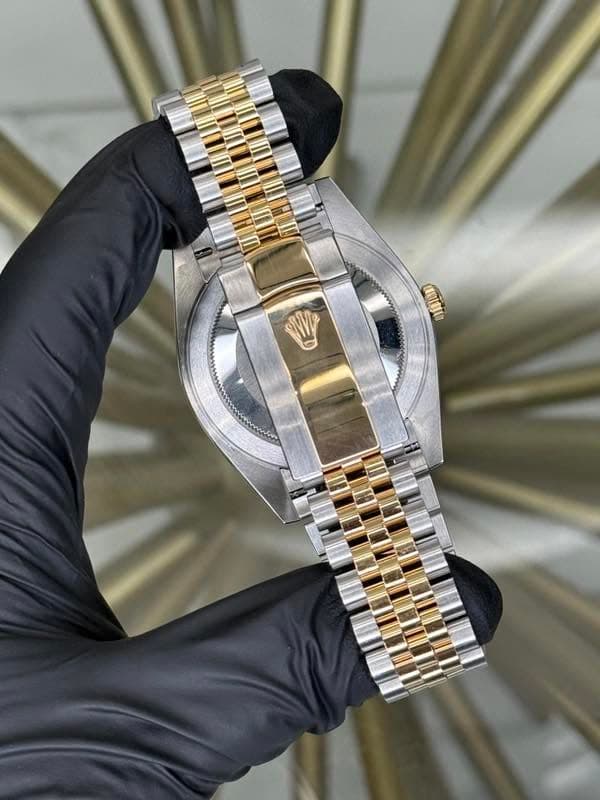 May be an image of wrist watch and text