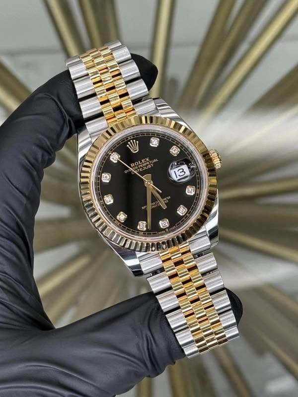 May be an image of wrist watch and text