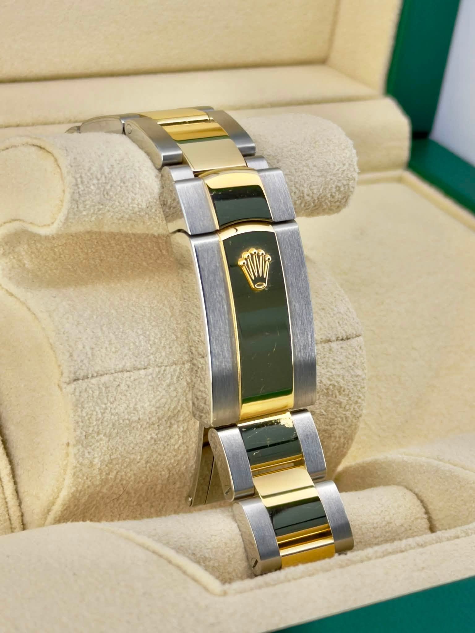May be an image of wrist watch, jewelry and text