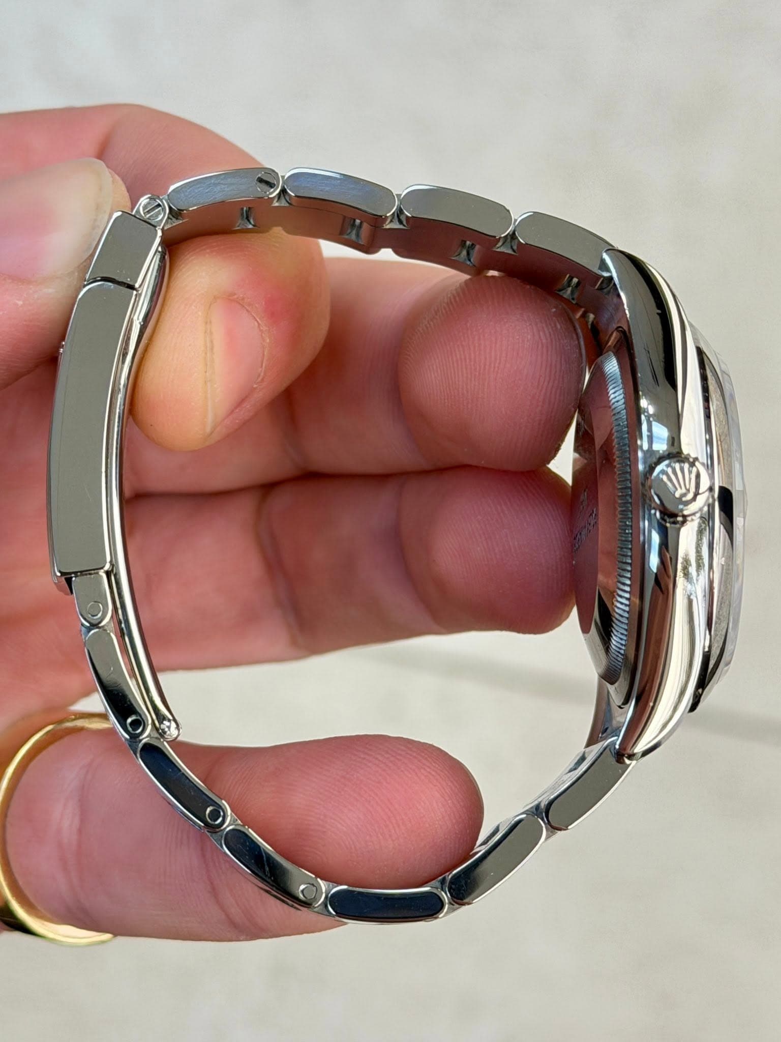 May be an image of wrist watch and jewelry