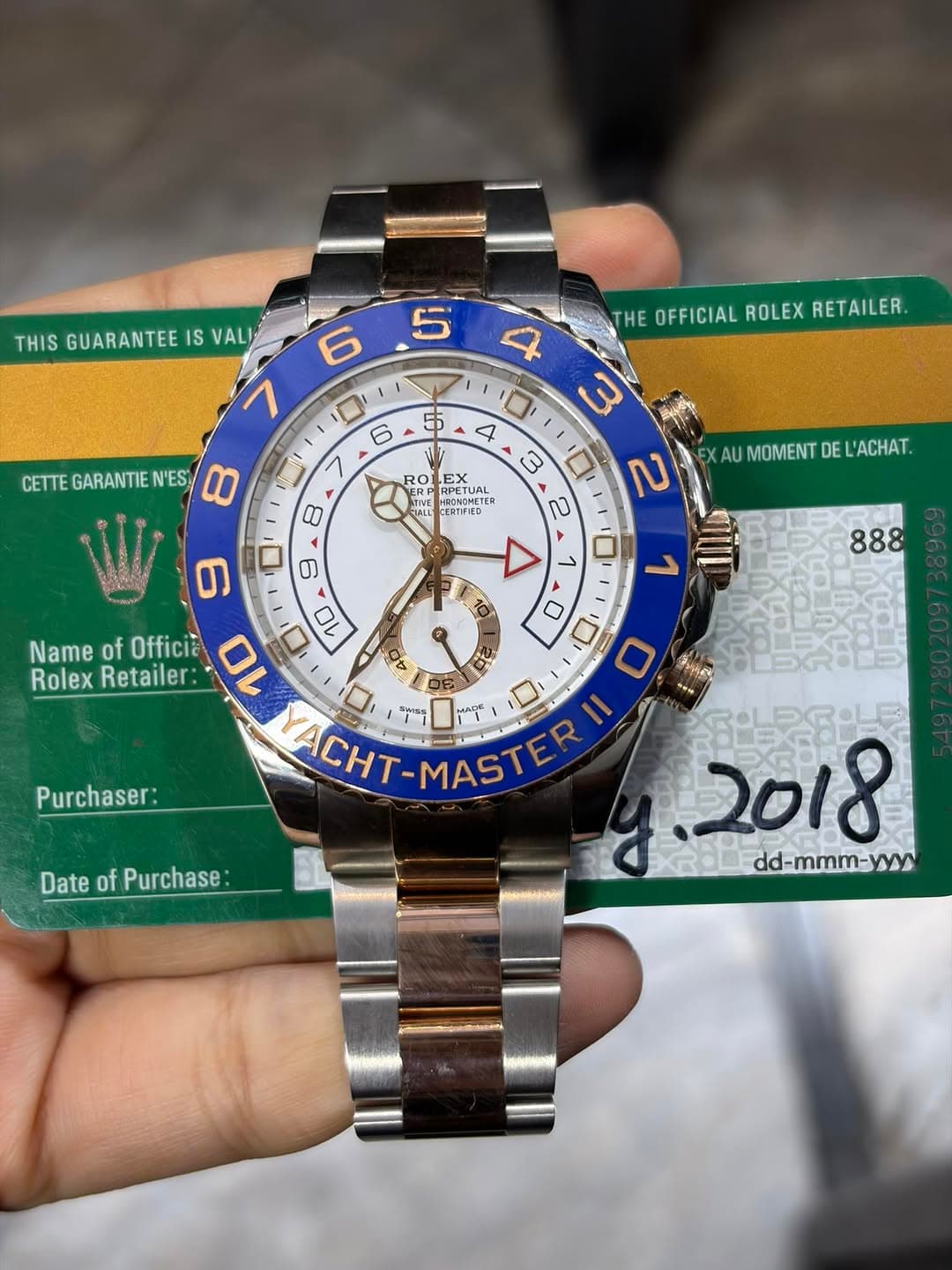 May be an image of wrist watch and text that says 'THIS GUARANTEE IS VALI 5 6 7 THE OFFICIAL ROLEX RETAILER. 5 CETTE GARANTIE 'ES 00 6 > 8 4 口 3 4 3 בח 2 RO DECTUAL EX RPETUA…