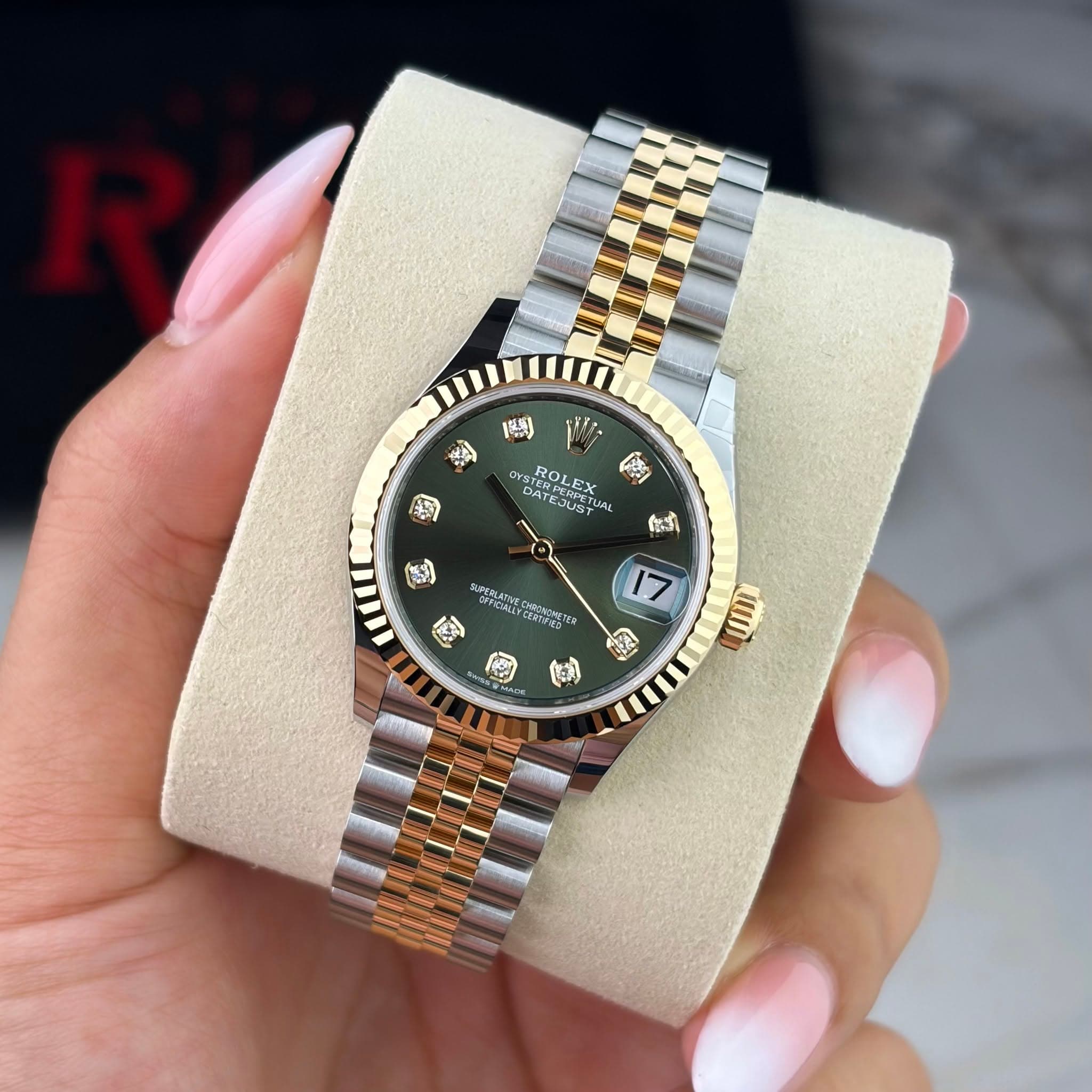 May be an image of wrist watch and text