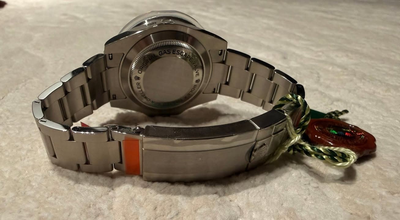May be an image of wrist watch and text