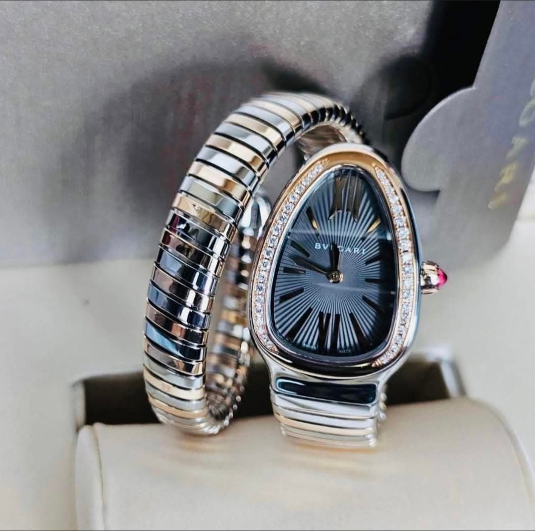 May be an image of digital watch, jewelry and text