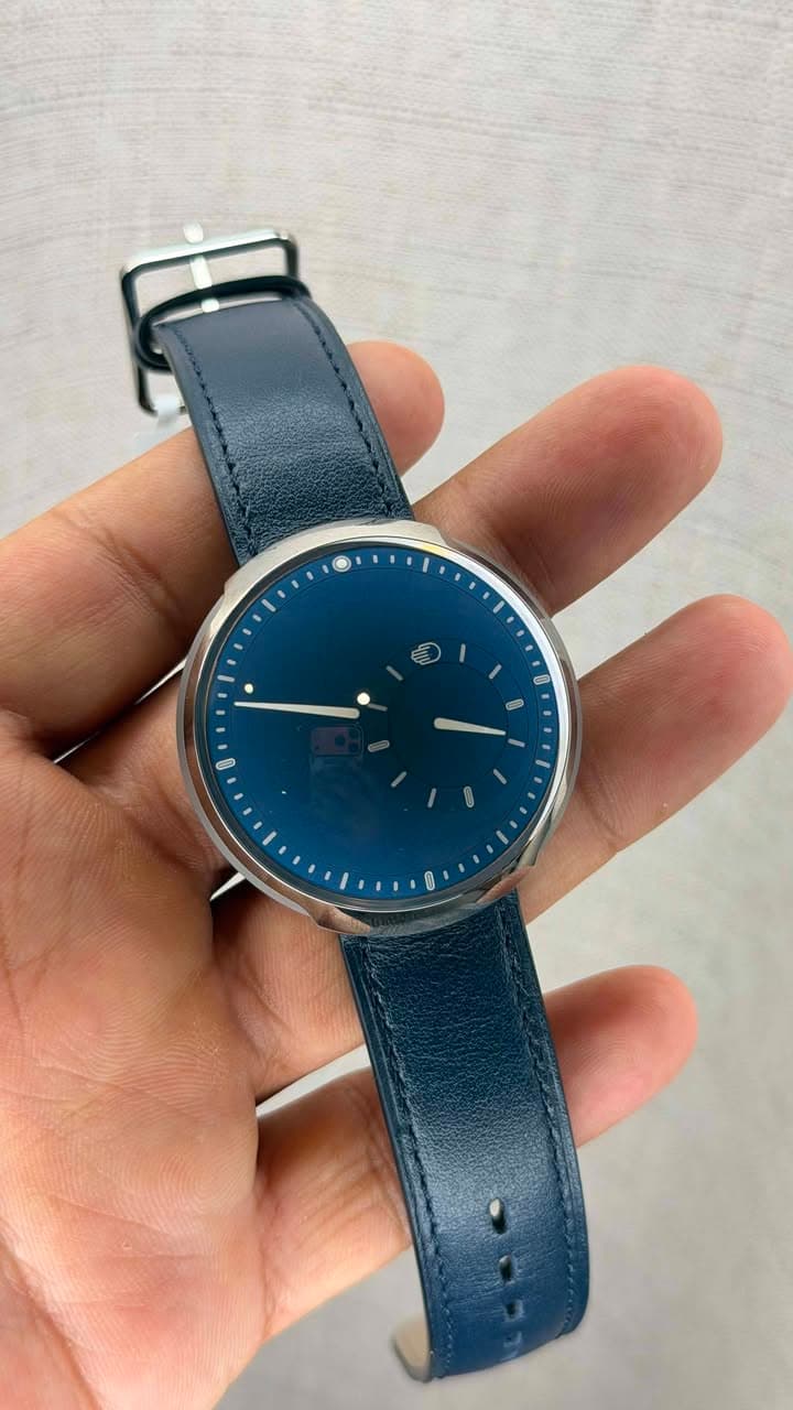 May be an image of wrist watch and text