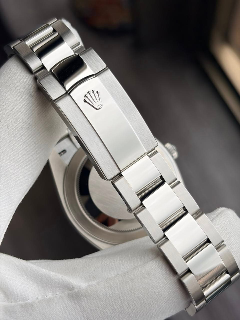 May be an image of wrist watch and text