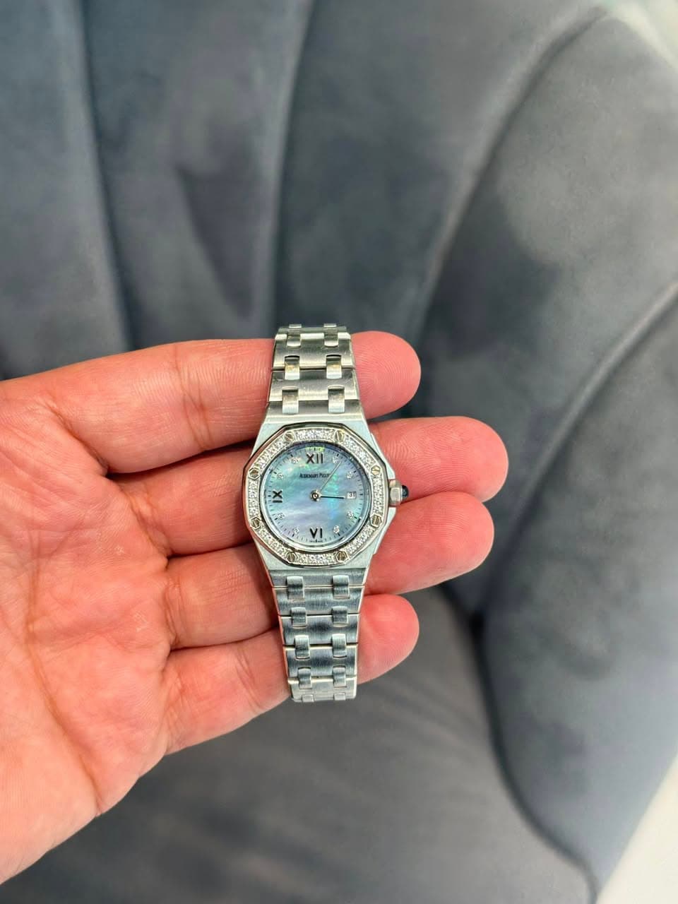May be an image of wrist watch and text