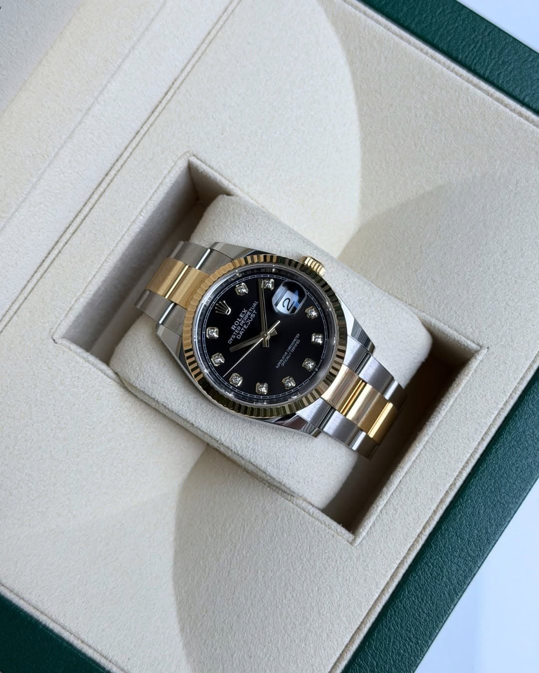 May be an image of wrist watch and text