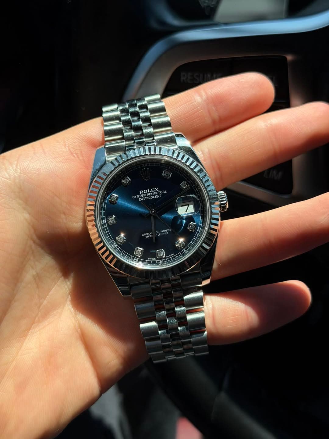 May be an image of wrist watch and text