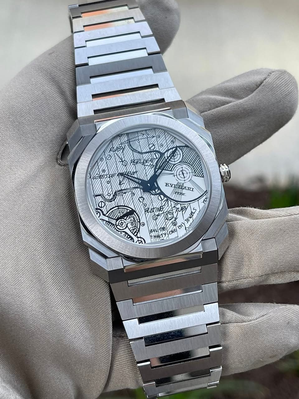 May be an image of wrist watch and text