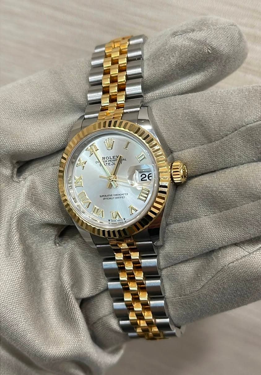 May be an image of wrist watch and text
