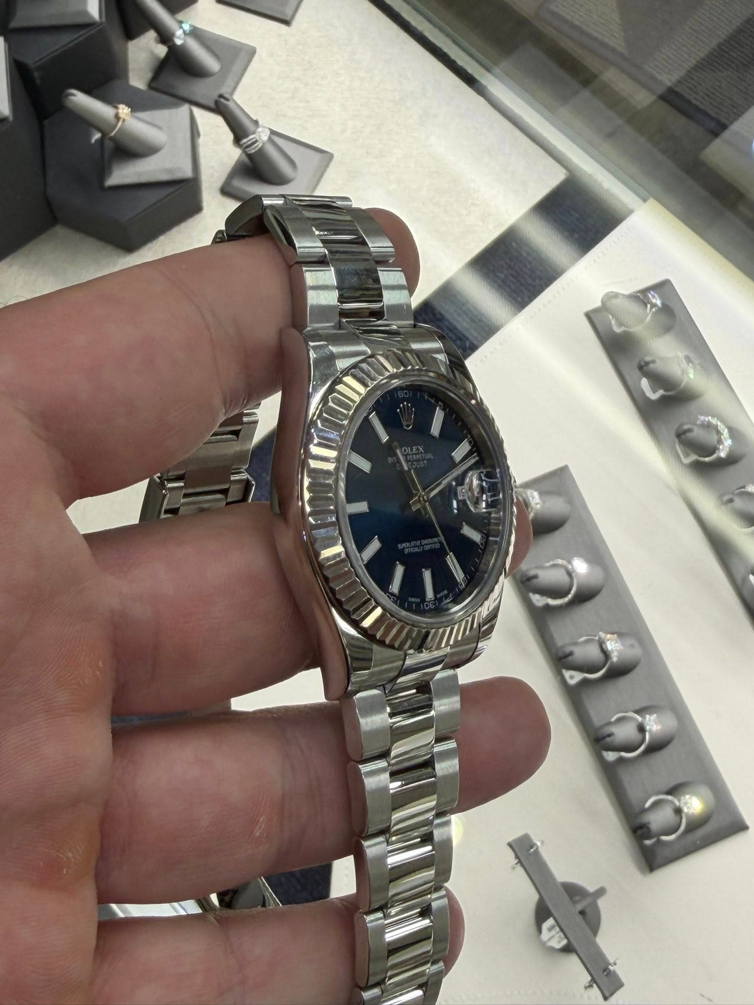 May be an image of wrist watch and text