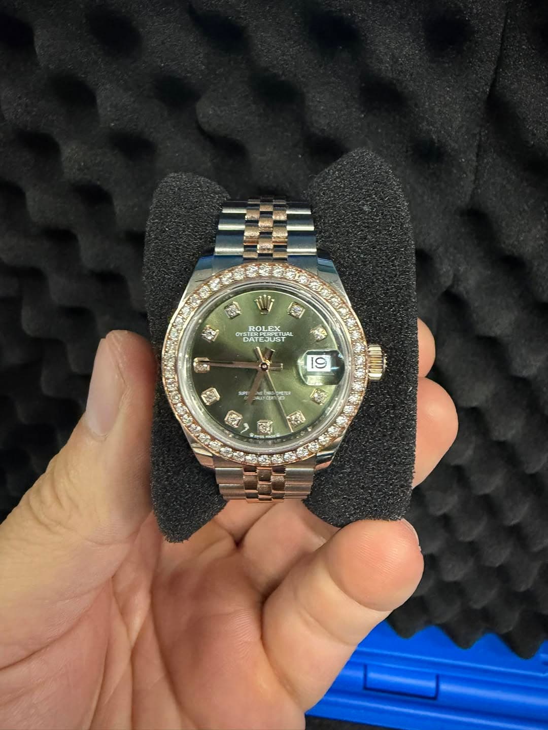 May be an image of wrist watch and text