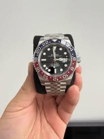 May be an image of wrist watch and text