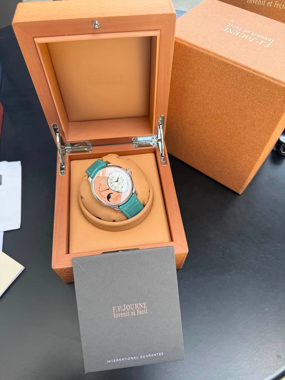 May be an image of wrist watch and text