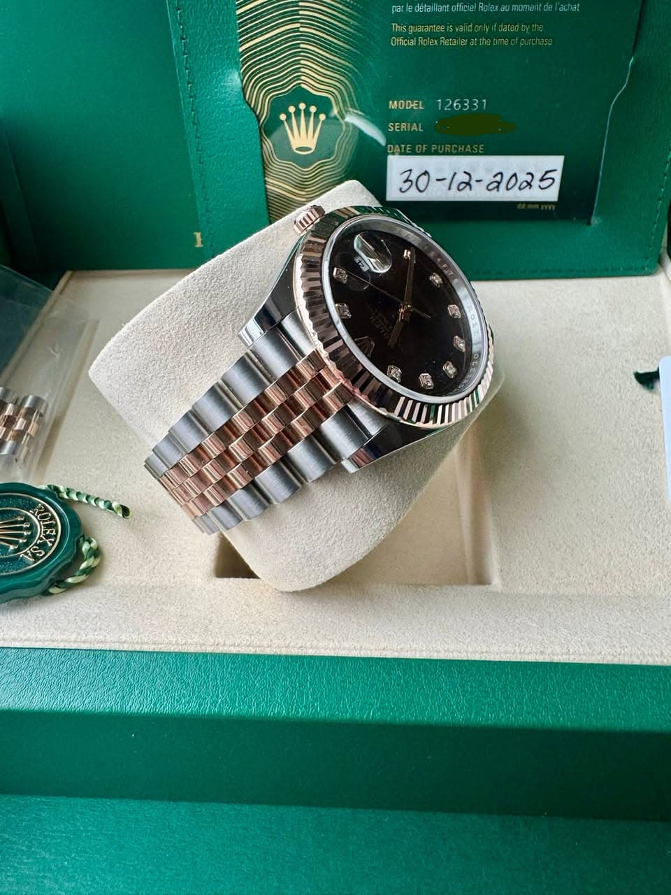 May be an image of wrist watch and text
