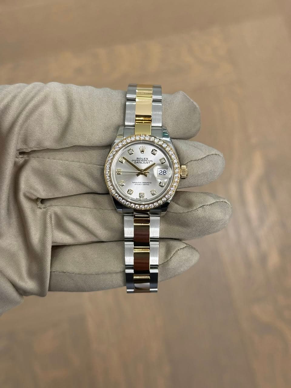May be an image of wrist watch and text