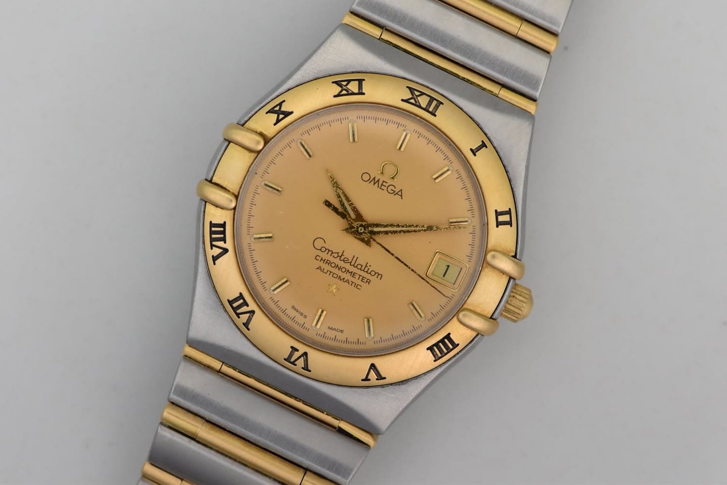May be an image of wrist watch and text