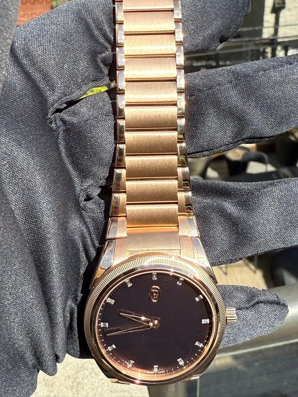 May be an image of wrist watch and text