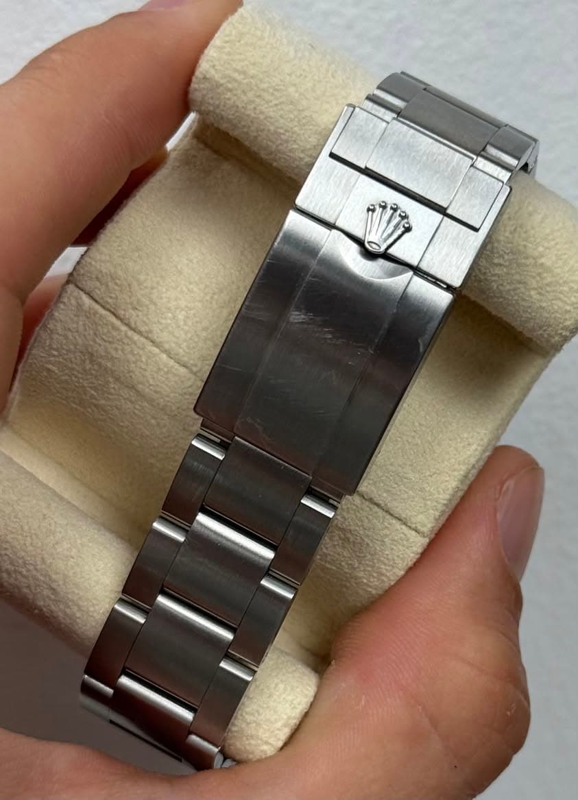 May be an image of wrist watch and text
