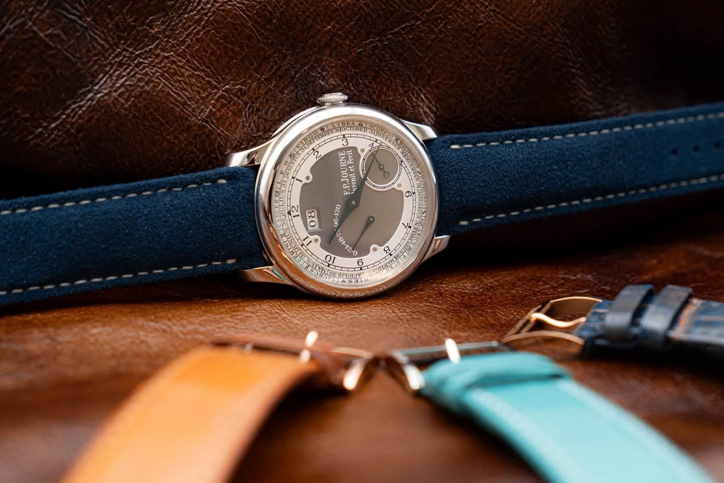 May be an image of leather, wrist watch, saddle-stitched leather and text