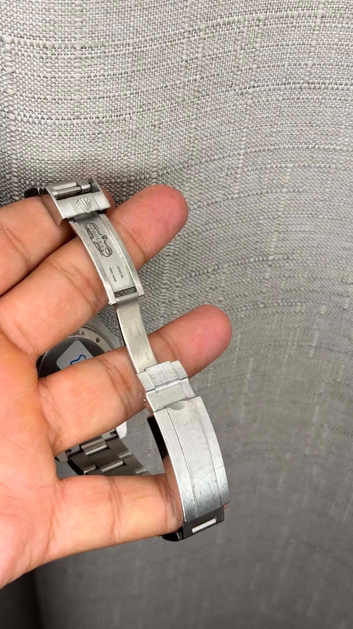May be an image of wrist watch and text