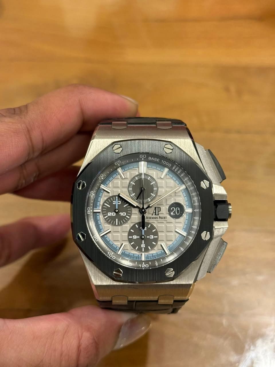 May be an image of wrist watch and text