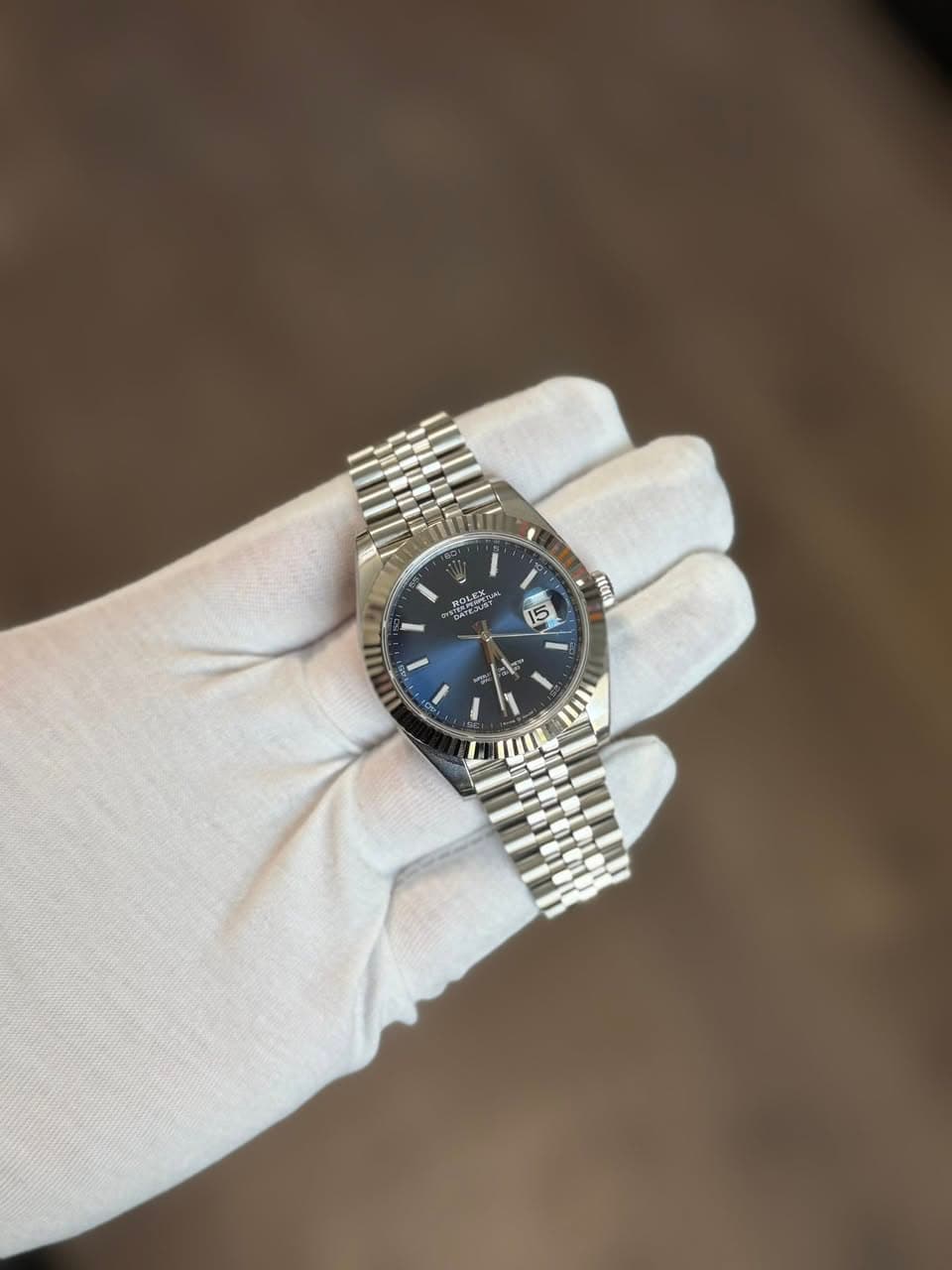 May be an image of wrist watch and text