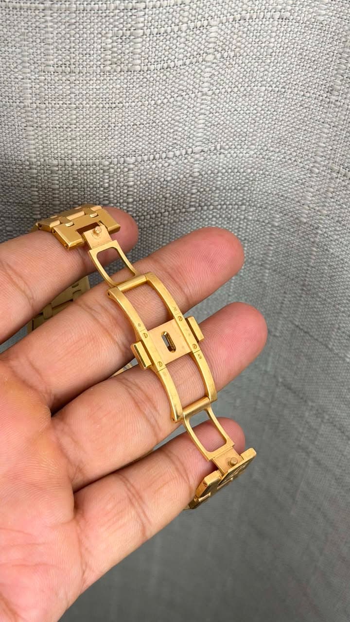 May be an image of jewelry, wrist watch and text