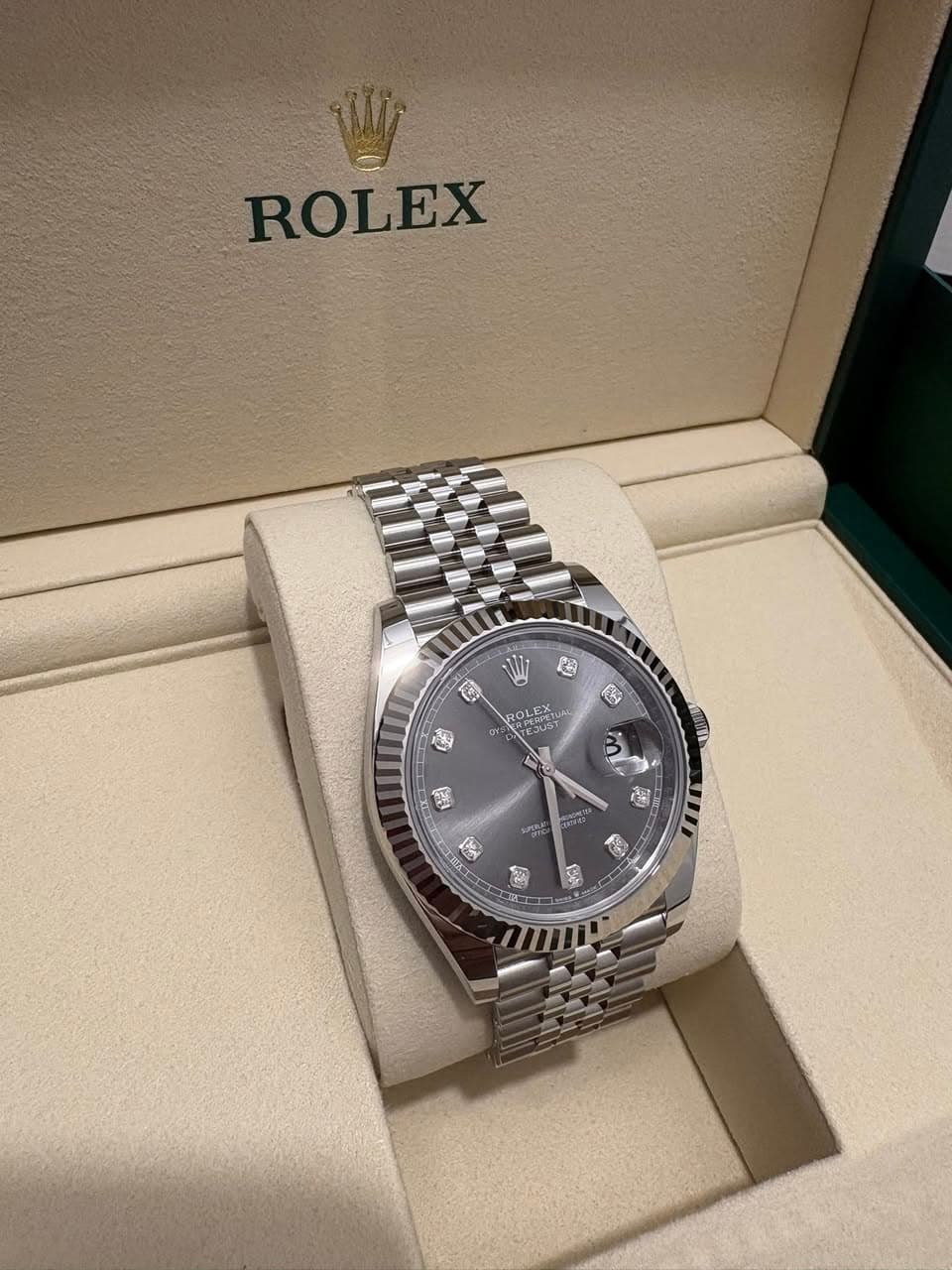 May be an image of wrist watch and text