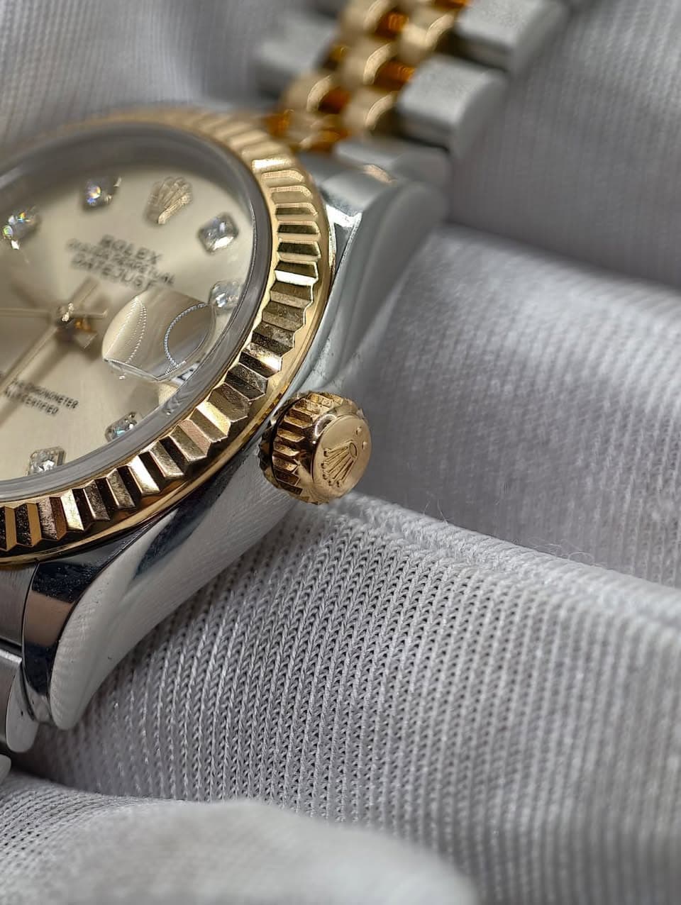 May be an image of wrist watch and text