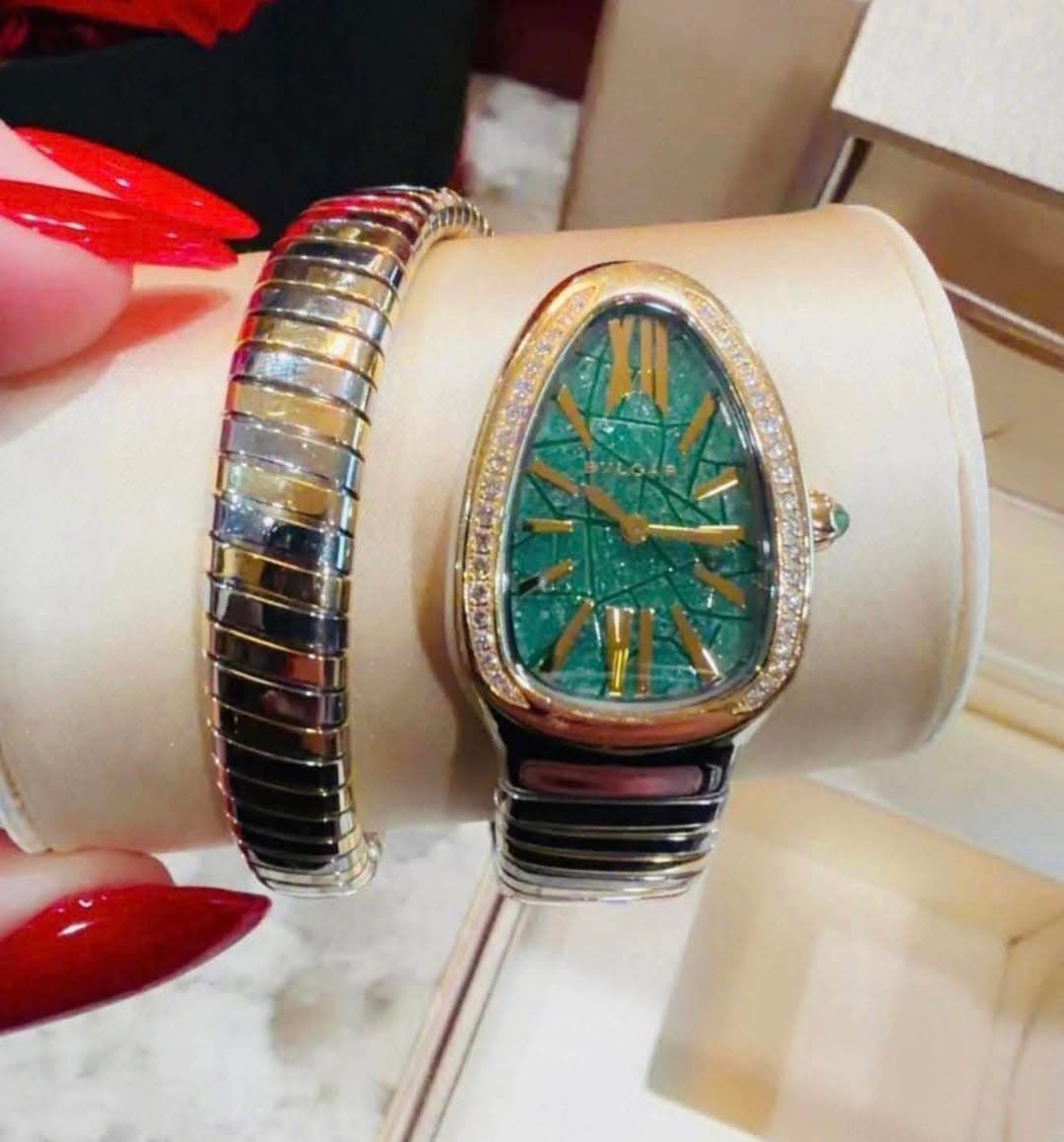 May be an image of jewelry and wrist watch