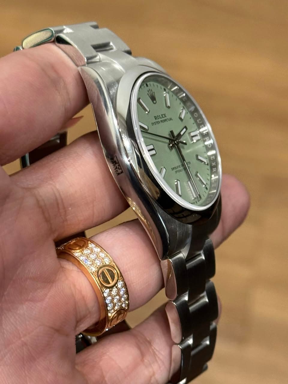 May be an image of wrist watch and text