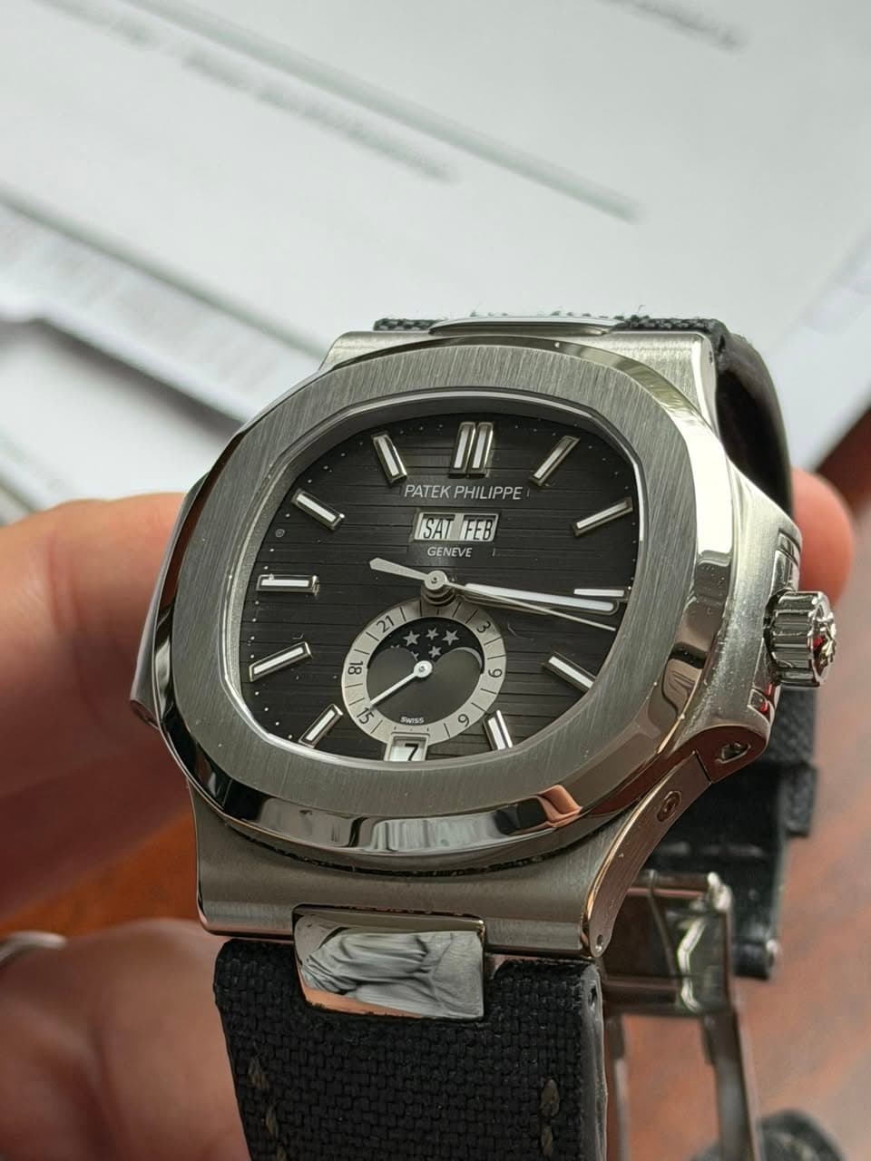May be an image of wrist watch and text