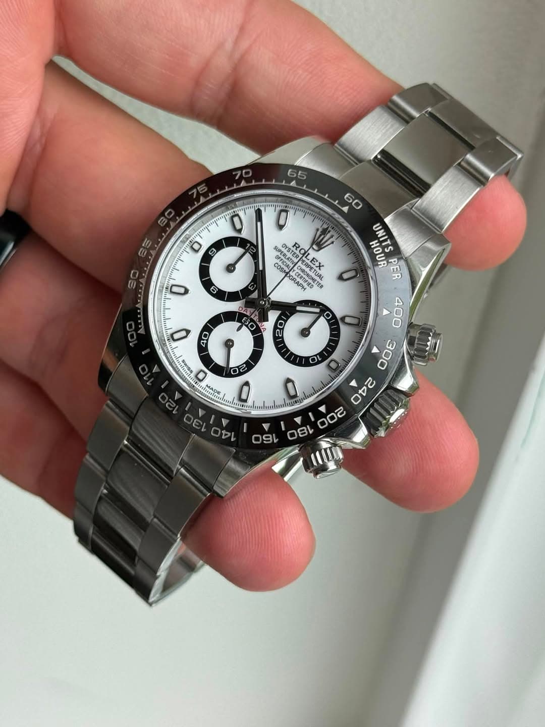 May be an image of wrist watch and text
