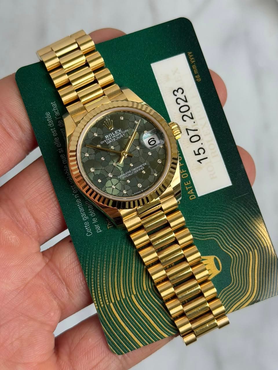 May be an image of wrist watch and text