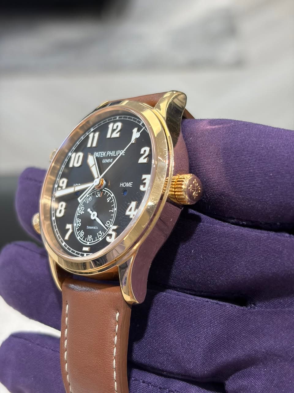 May be an image of leather, wrist watch and text