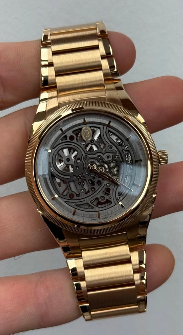 May be an image of wrist watch and text