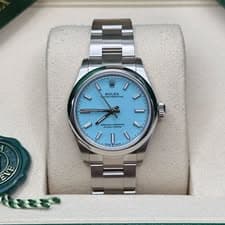 May be an image of wrist watch and text that says '10 I ROLEX EX ROLE ESTER PERPETU ROLEXIUAL PERP UAL 0 אהאכדום FCIALL wIs 野 - LADE EVE'