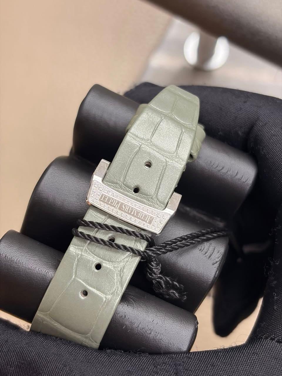 May be an image of leather and wrist watch
